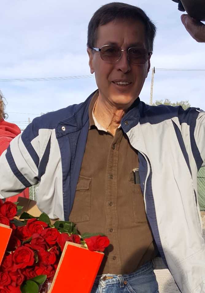 Ed Janzen with a box full of roses
